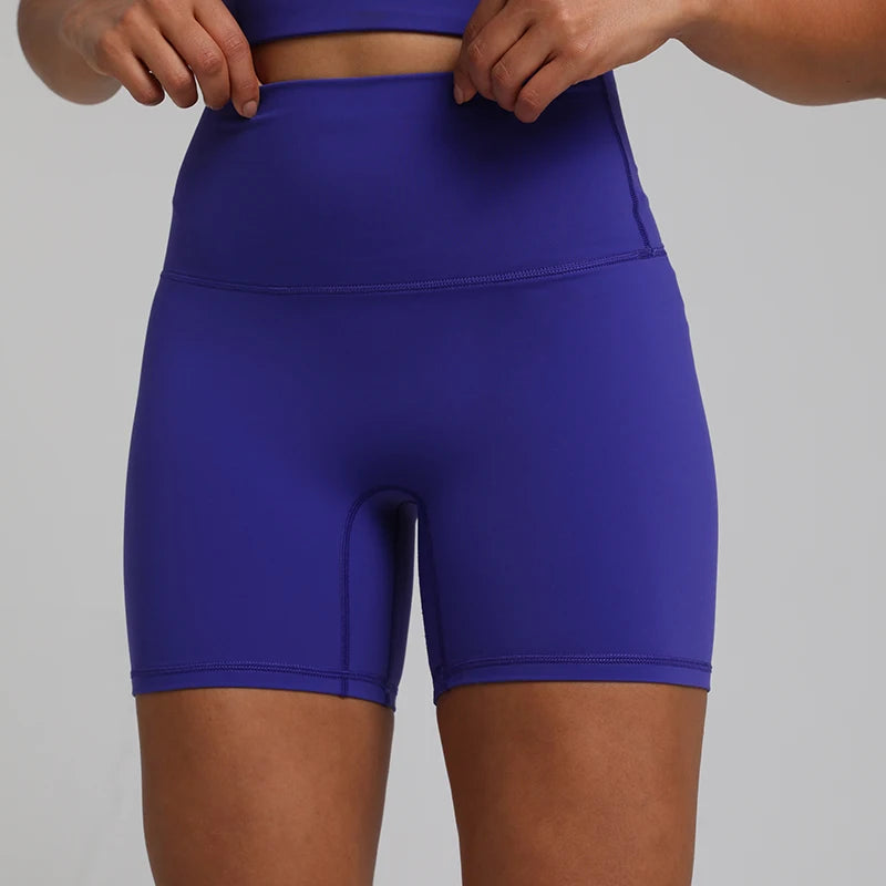 High-waisted, no front seam biker shorts for women, made from buttery-soft spandex. Perfect for gym workouts, yoga, and sports, offering comfort, support, and a flattering fit with 5-inch inseam.