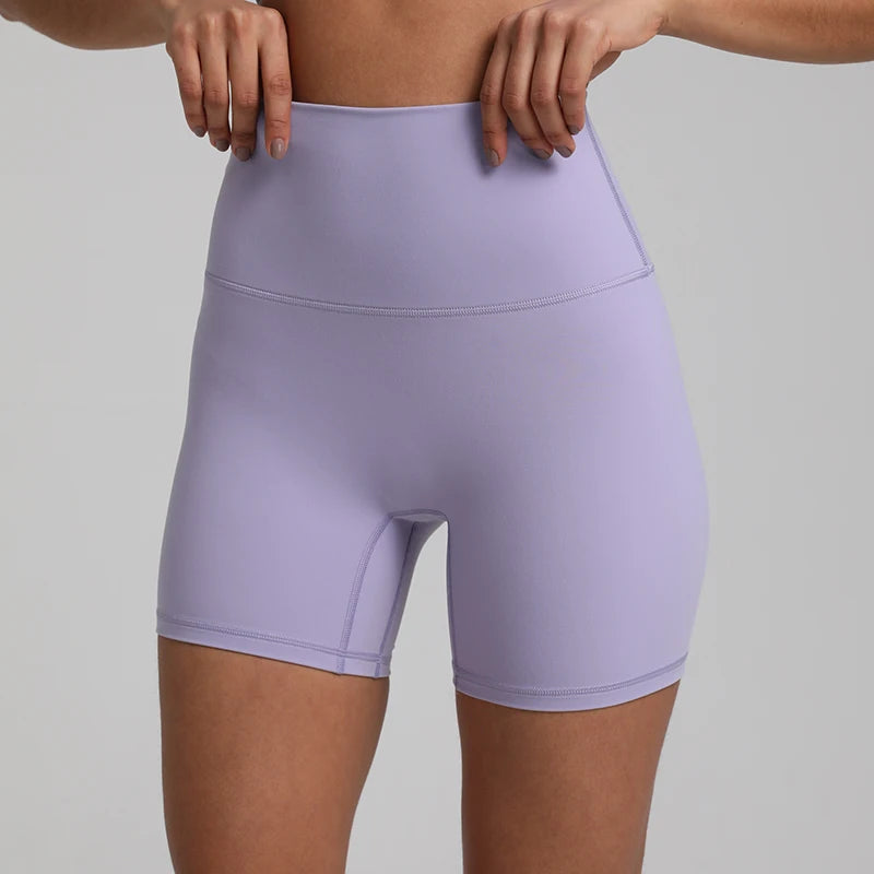 High-waisted, no front seam biker shorts for women, made from buttery-soft spandex. Perfect for gym workouts, yoga, and sports, offering comfort, support, and a flattering fit with 5-inch inseam.