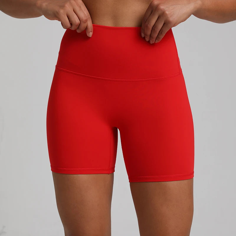 High-waisted, no front seam biker shorts for women, made from buttery-soft spandex. Perfect for gym workouts, yoga, and sports, offering comfort, support, and a flattering fit with 5-inch inseam.