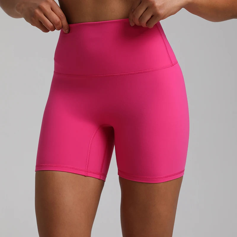 High-waisted, no front seam biker shorts for women, made from buttery-soft spandex. Perfect for gym workouts, yoga, and sports, offering comfort, support, and a flattering fit with 5-inch inseam.