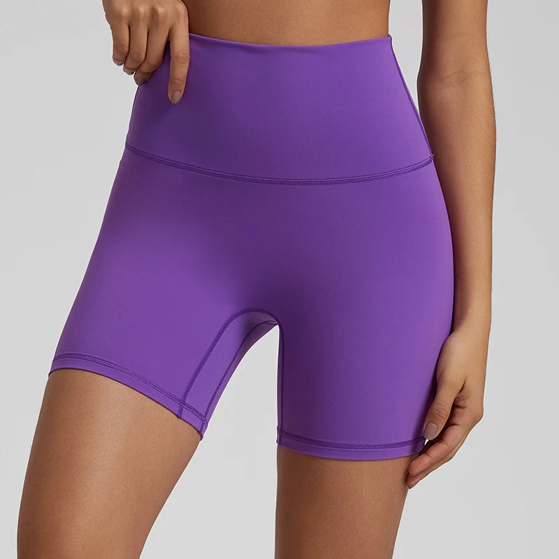 High-waisted, no front seam biker shorts for women, made from buttery-soft spandex. Perfect for gym workouts, yoga, and sports, offering comfort, support, and a flattering fit with 5-inch inseam.