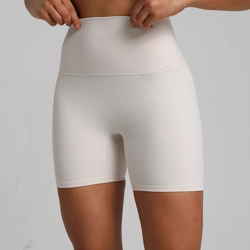 High-waisted, no front seam biker shorts for women, made from buttery-soft spandex. Perfect for gym workouts, yoga, and sports, offering comfort, support, and a flattering fit with 5-inch inseam.