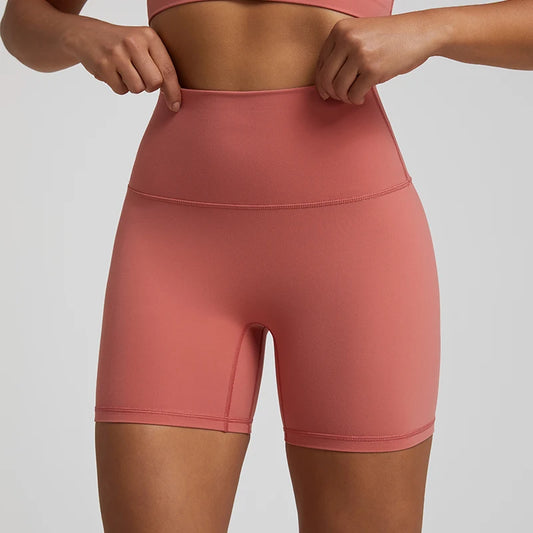 High-waisted, no front seam biker shorts for women, made from buttery-soft spandex. Perfect for gym workouts, yoga, and sports, offering comfort, support, and a flattering fit with 5-inch inseam.