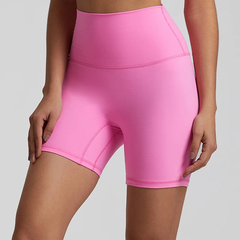 High-waisted, no front seam biker shorts for women, made from buttery-soft spandex. Perfect for gym workouts, yoga, and sports, offering comfort, support, and a flattering fit with 5-inch inseam.