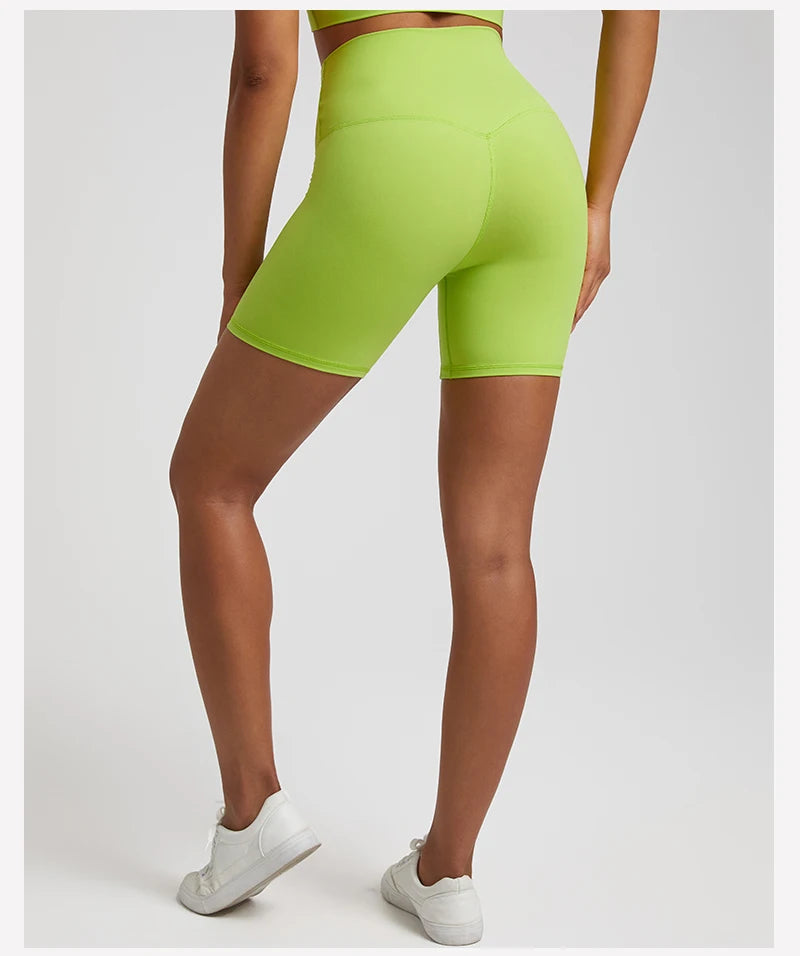 High-waisted, no front seam biker shorts for women, made from buttery-soft spandex. Perfect for gym workouts, yoga, and sports, offering comfort, support, and a flattering fit with 5-inch inseam.