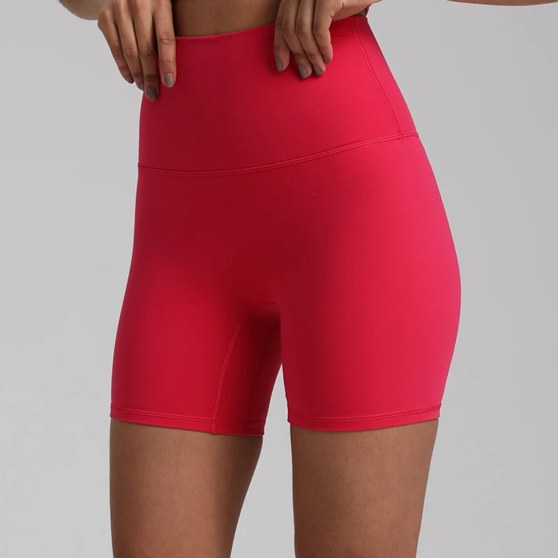 High-waisted, no front seam biker shorts for women, made from buttery-soft spandex. Perfect for gym workouts, yoga, and sports, offering comfort, support, and a flattering fit with 5-inch inseam.