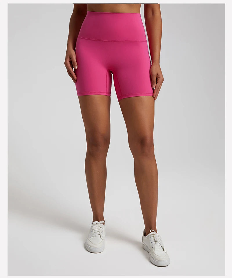 High-waisted, no front seam biker shorts for women, made from buttery-soft spandex. Perfect for gym workouts, yoga, and sports, offering comfort, support, and a flattering fit with 5-inch inseam.