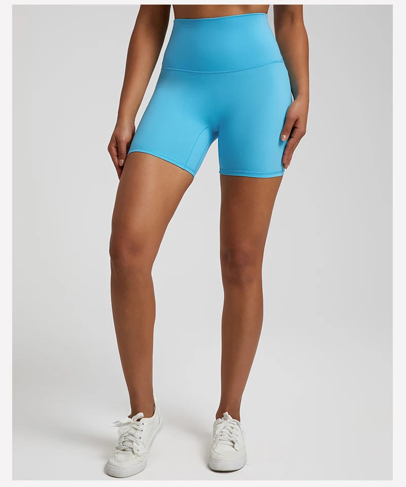 High-waisted, no front seam biker shorts for women, made from buttery-soft spandex. Perfect for gym workouts, yoga, and sports, offering comfort, support, and a flattering fit with 5-inch inseam.