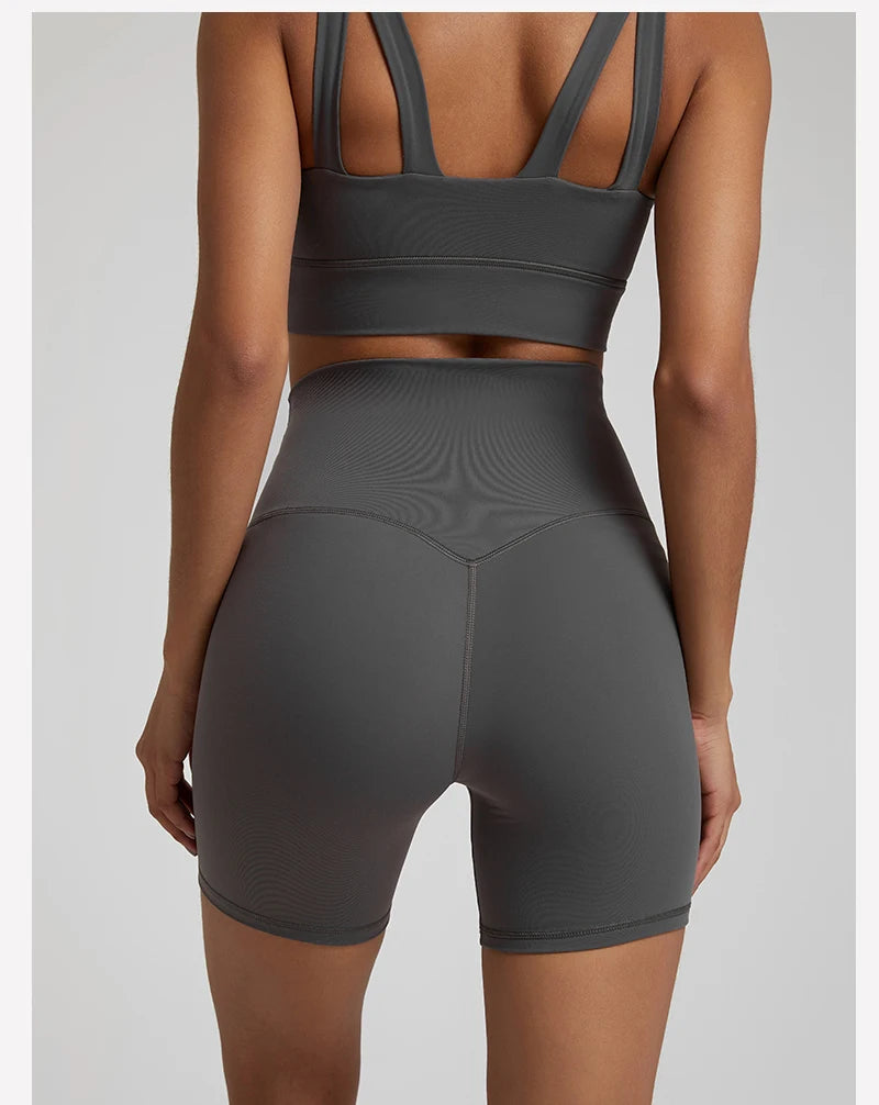 High-waisted, no front seam biker shorts for women, made from buttery-soft spandex. Perfect for gym workouts, yoga, and sports, offering comfort, support, and a flattering fit with 5-inch inseam.