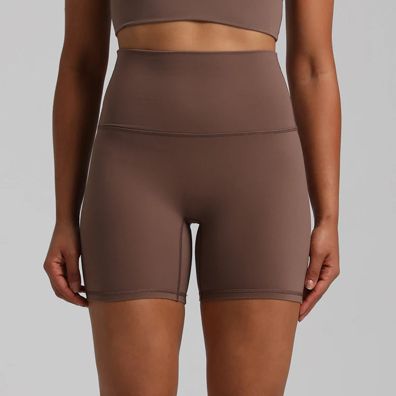 High-waisted, no front seam biker shorts for women, made from buttery-soft spandex. Perfect for gym workouts, yoga, and sports, offering comfort, support, and a flattering fit with 5-inch inseam.