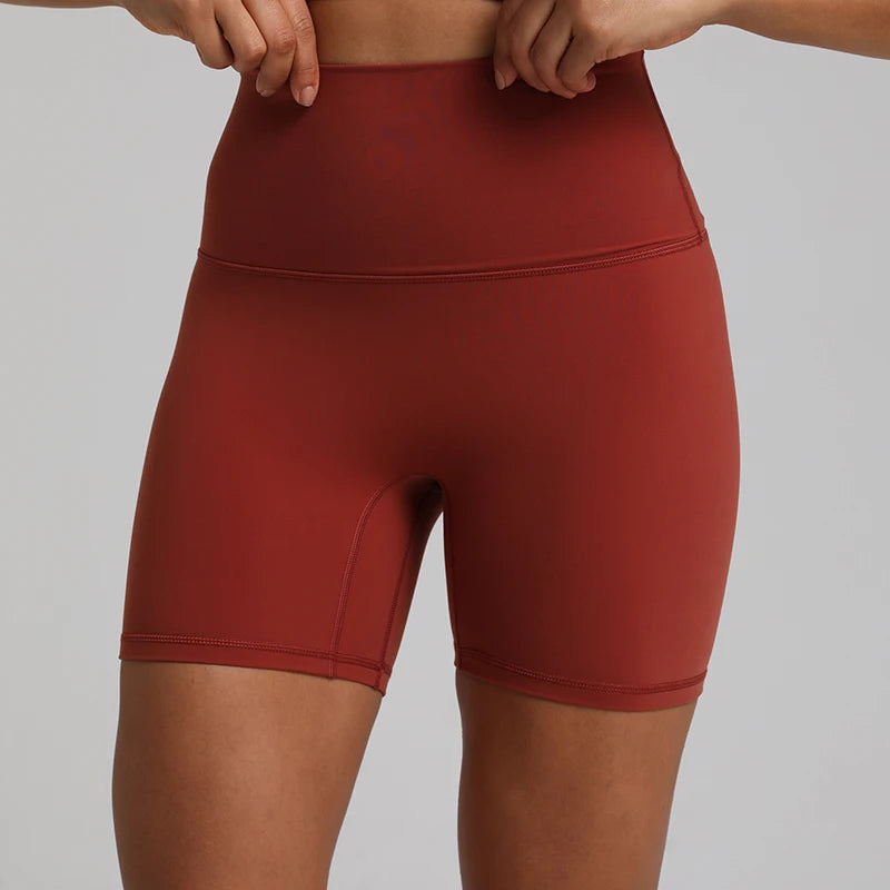 High-waisted, no front seam biker shorts for women, made from buttery-soft spandex. Perfect for gym workouts, yoga, and sports, offering comfort, support, and a flattering fit with 5-inch inseam.