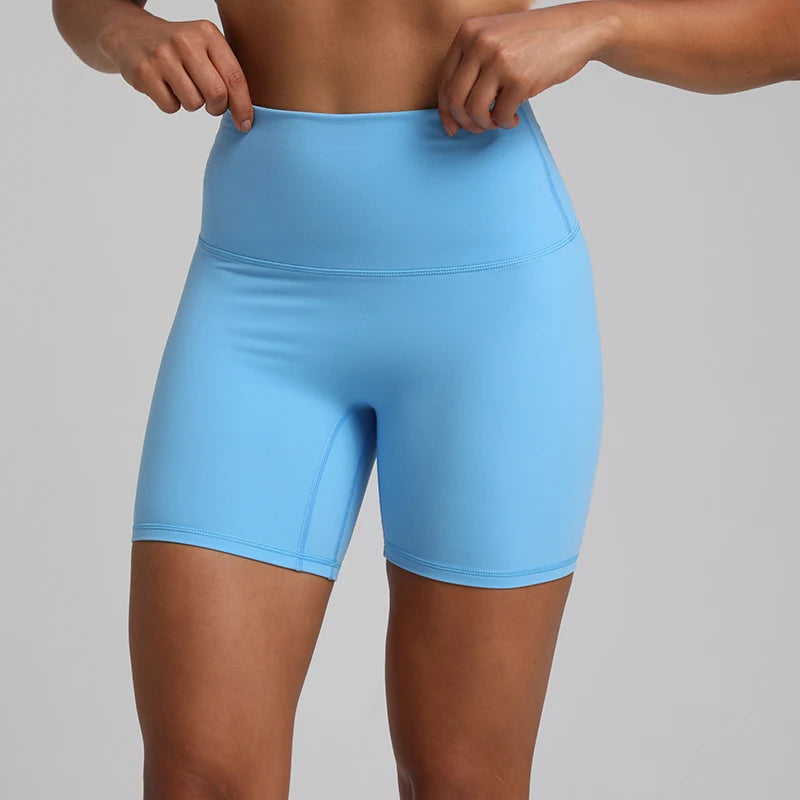 High-waisted, no front seam biker shorts for women, made from buttery-soft spandex. Perfect for gym workouts, yoga, and sports, offering comfort, support, and a flattering fit with 5-inch inseam.