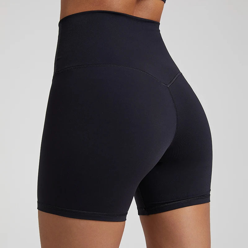 High-waisted, no front seam biker shorts for women, made from buttery-soft spandex. Perfect for gym workouts, yoga, and sports, offering comfort, support, and a flattering fit with 5-inch inseam.