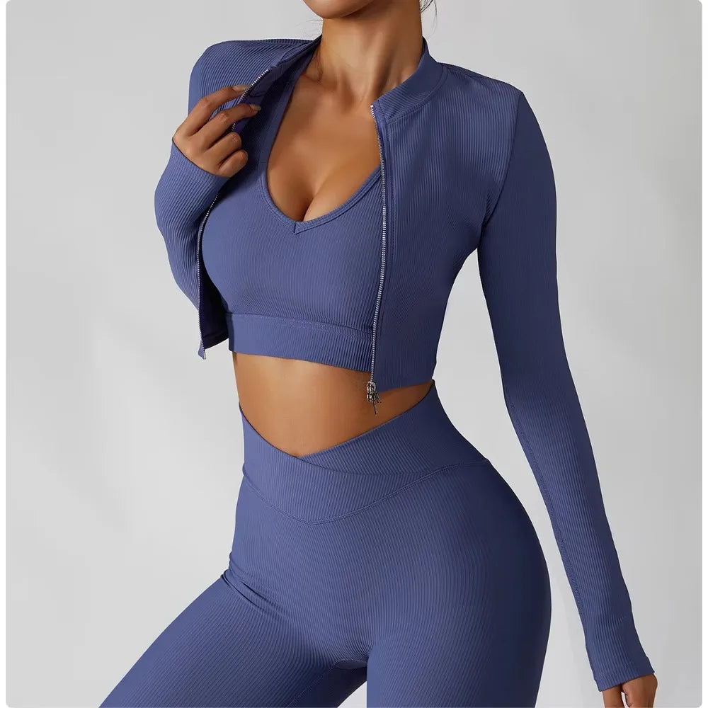 Women's 3-Piece Tracksuit Set featuring a stylish jacket, sports bra, and leggings. Designed for comfort and support, perfect for workouts, yoga, and gym training. The high-performance material offers a flattering fit, enhanced flexibility, and breathable fabric for maximum mobility and confidence during exercise. Ideal for fitness enthusiasts seeking a versatile, chic sportswear set.