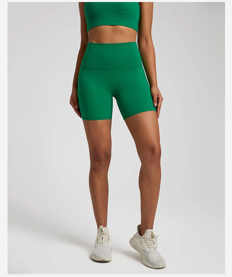 High-waisted, no front seam biker shorts for women, made from buttery-soft spandex. Perfect for gym workouts, yoga, and sports, offering comfort, support, and a flattering fit with 5-inch inseam.