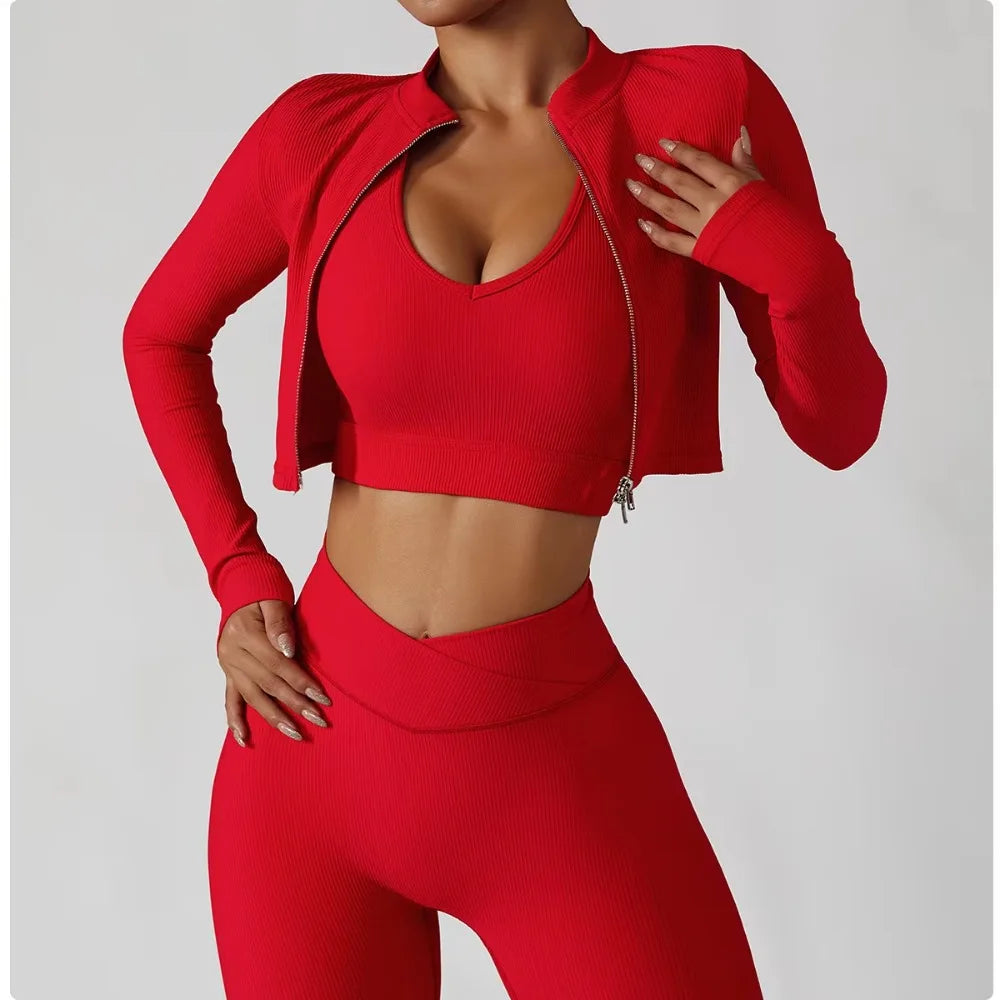 Women's 3-Piece Tracksuit Set featuring a stylish jacket, sports bra, and leggings. Designed for comfort and support, perfect for workouts, yoga, and gym training. The high-performance material offers a flattering fit, enhanced flexibility, and breathable fabric for maximum mobility and confidence during exercise. Ideal for fitness enthusiasts seeking a versatile, chic sportswear set.