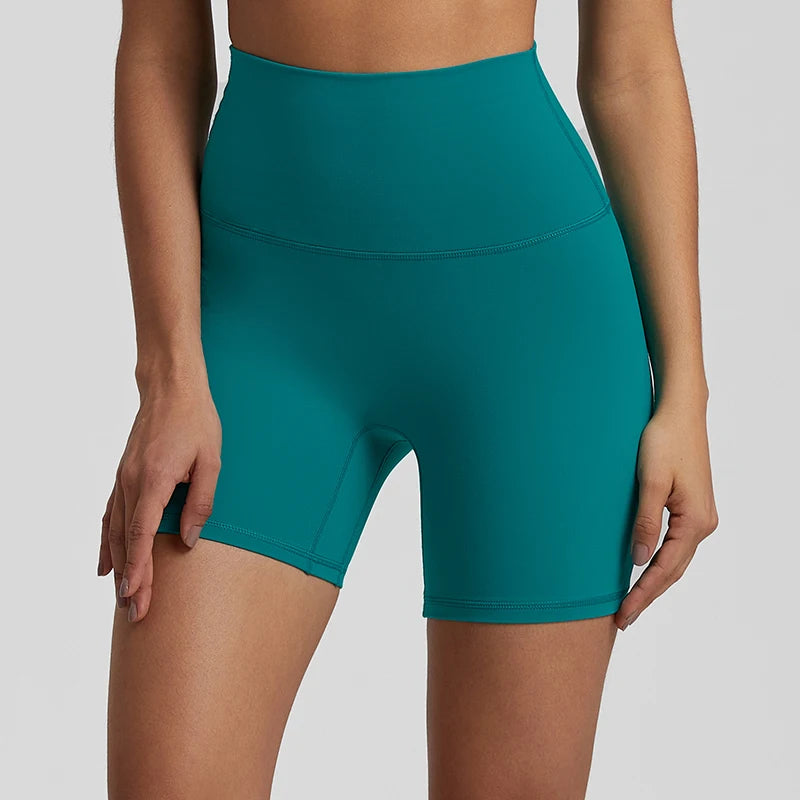 High-waisted, no front seam biker shorts for women, made from buttery-soft spandex. Perfect for gym workouts, yoga, and sports, offering comfort, support, and a flattering fit with 5-inch inseam.