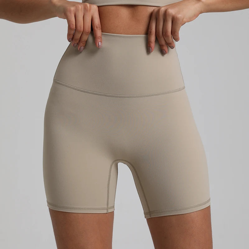 High-waisted, no front seam biker shorts for women, made from buttery-soft spandex. Perfect for gym workouts, yoga, and sports, offering comfort, support, and a flattering fit with 5-inch inseam.