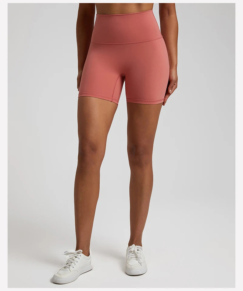 High-waisted, no front seam biker shorts for women, made from buttery-soft spandex. Perfect for gym workouts, yoga, and sports, offering comfort, support, and a flattering fit with 5-inch inseam.