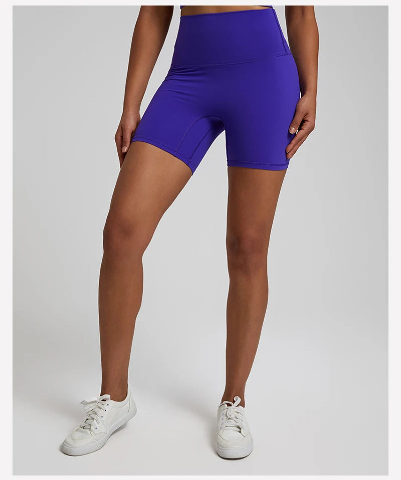 High-waisted, no front seam biker shorts for women, made from buttery-soft spandex. Perfect for gym workouts, yoga, and sports, offering comfort, support, and a flattering fit with 5-inch inseam.