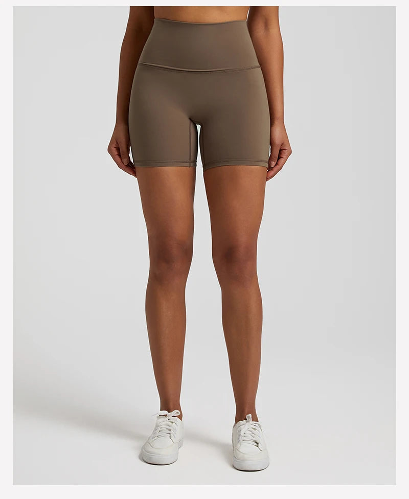 High-waisted, no front seam biker shorts for women, made from buttery-soft spandex. Perfect for gym workouts, yoga, and sports, offering comfort, support, and a flattering fit with 5-inch inseam.