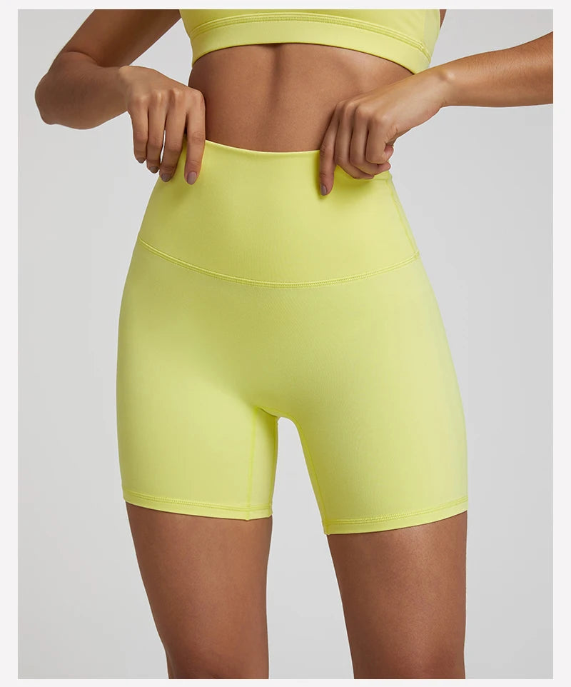 High-waisted, no front seam biker shorts for women, made from buttery-soft spandex. Perfect for gym workouts, yoga, and sports, offering comfort, support, and a flattering fit with 5-inch inseam.