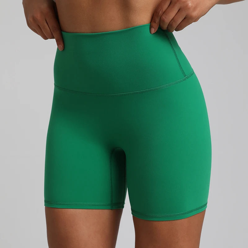 High-waisted, no front seam biker shorts for women, made from buttery-soft spandex. Perfect for gym workouts, yoga, and sports, offering comfort, support, and a flattering fit with 5-inch inseam.